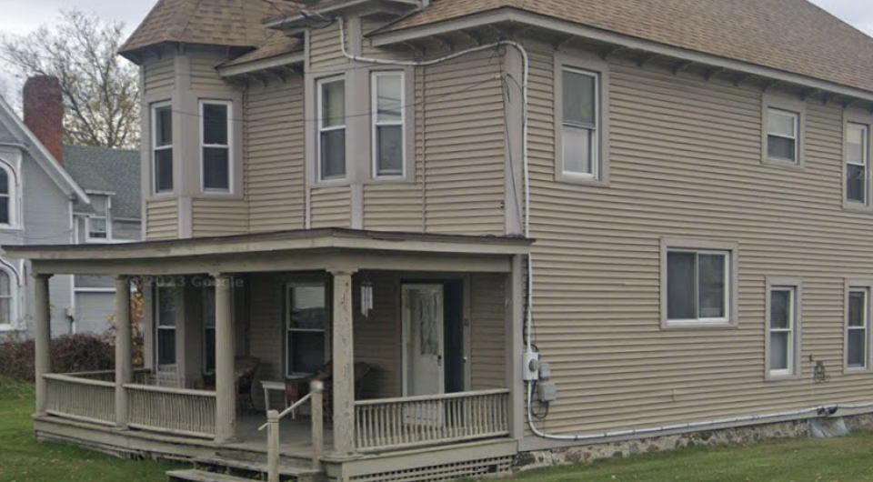 Brown Vinyl exterior of a church outbuilding