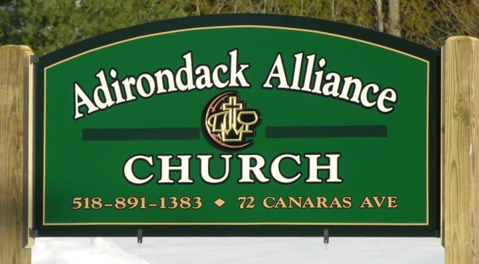 Green sign for the adirondack alliance church