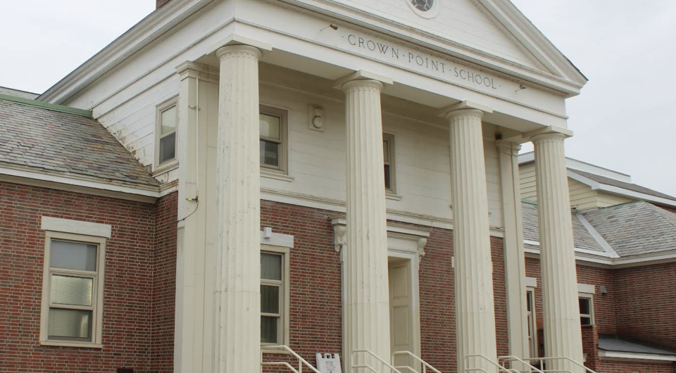 Tall white columns create a grand entry to the Crown Point School