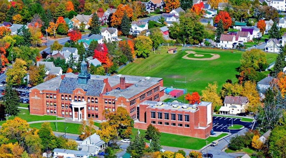 Areal view of the brick school and athletic fields behind