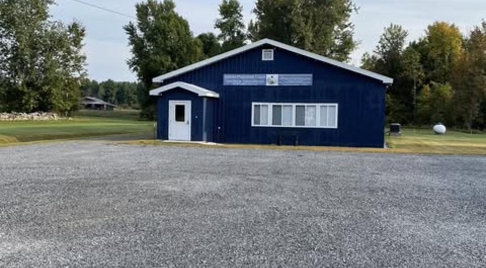 A blue building with white trim