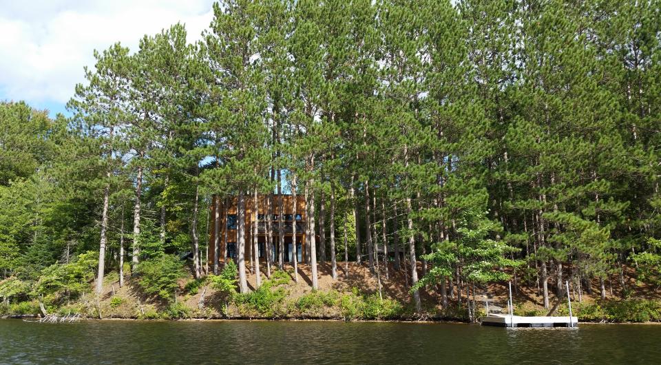 A modern home shrouded in fresh snow.