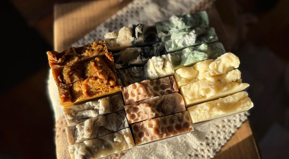 Soap on a wooden table titled balsam and bourbon.