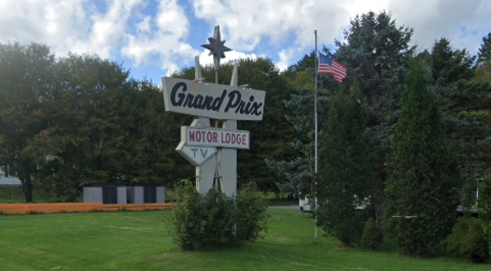 The sign for the Grand Prix Motor Lodge