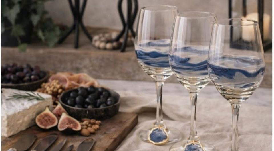 Blue glass cheese knives and wine glass charms.