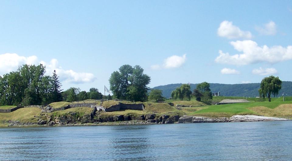 The view from the lake shows off the extensive grounds of Crown Point State Historic Site.