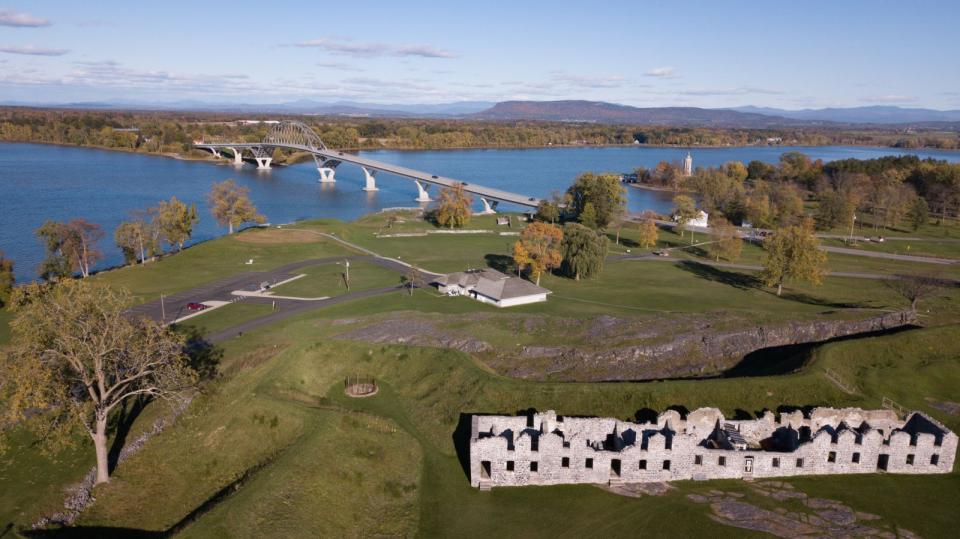 An aerial view of the ruins at Crown Point State Historic Site with the Lake Champlain Bridge in the background.