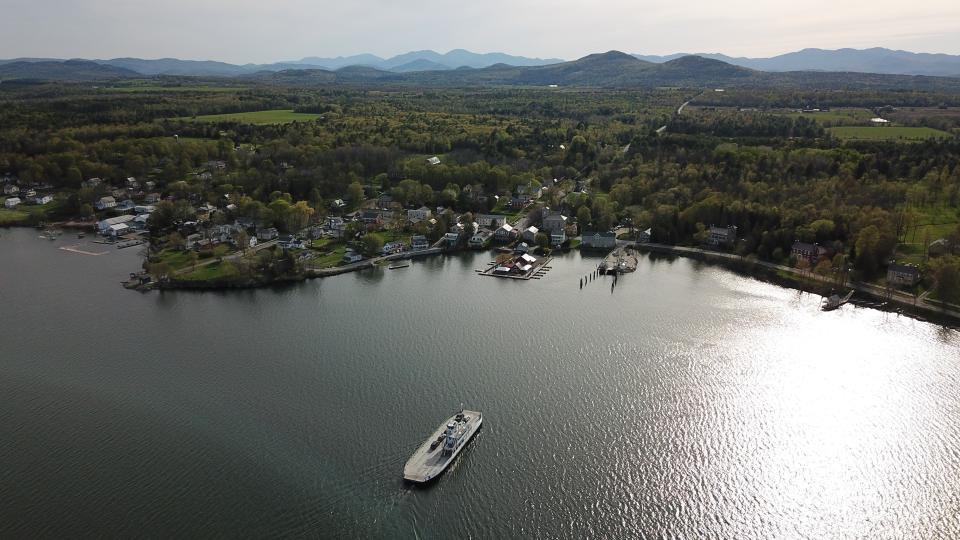 Aerial view of the village of Essex with Lake Champlain in the foreground and the Adirondacks in the background.
