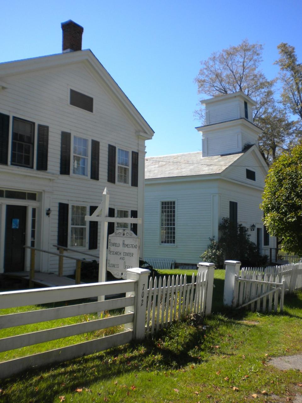The home and church of the Penfield Homestead Research Center.