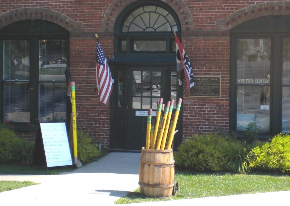 The exterior of the Ticonderoga Heritage Museum and its giant pencils.