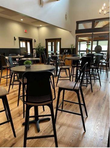 A view of tables and chairs inside The Tap Room