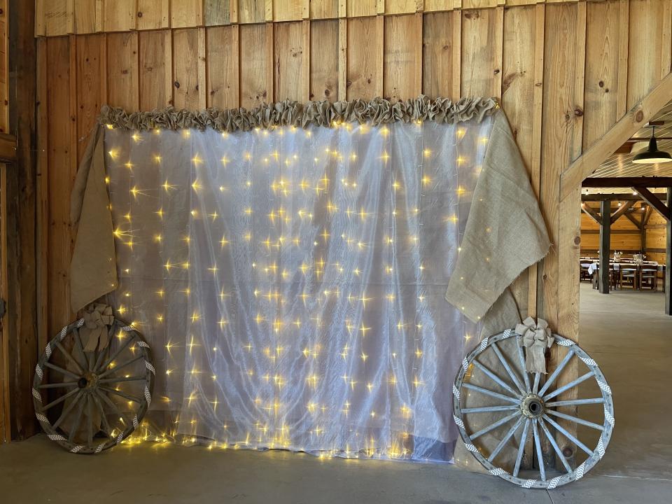 A photo op spot with lights and rustic decorations.