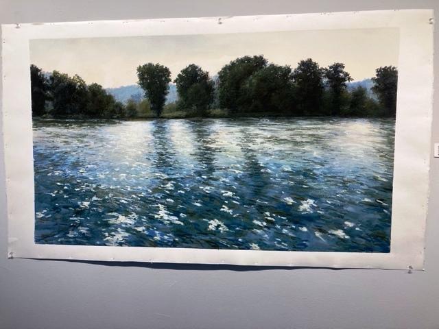 A painting of a body of water with trees on the bank.