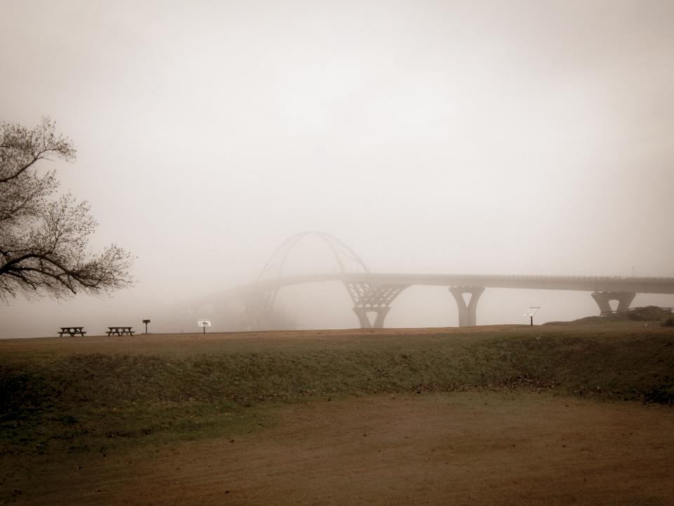 The Champlain Bridge in the fog.