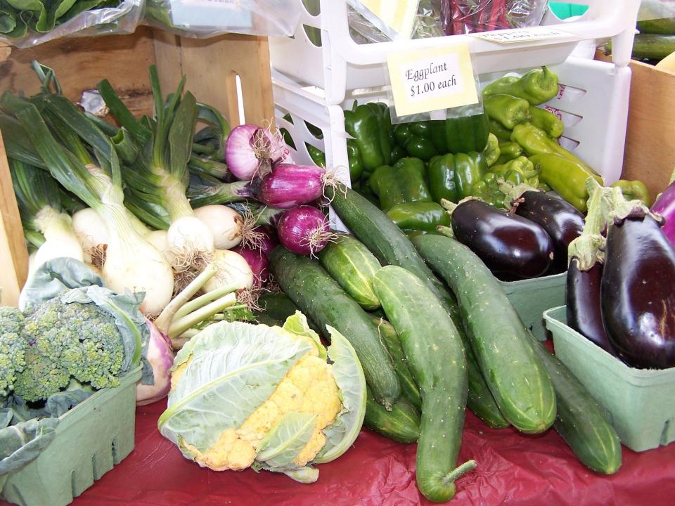 A close-up of a display of fresh farmers market produce