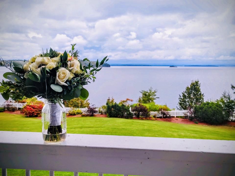 A bouquet of flowers from local farm overlooking an expansive lake.