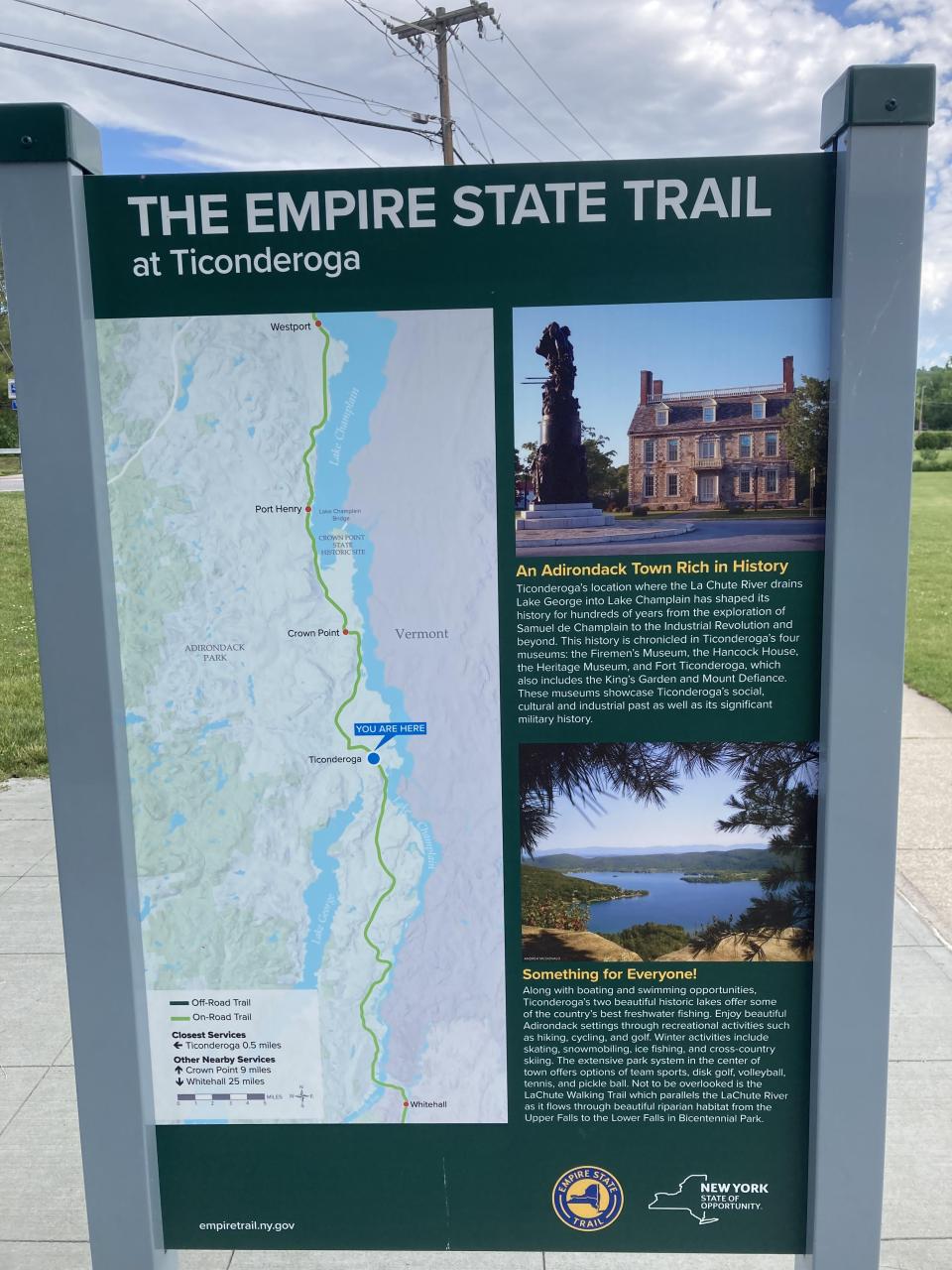 An interpretive sign for the Empire State Trail, a cycling route.