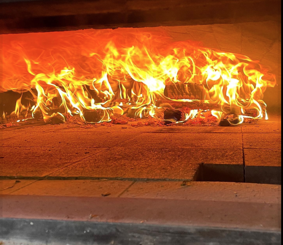 fire blazing in a wood-fired oven