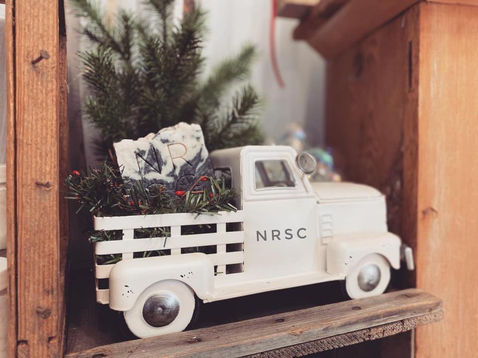 A toy truck loaded up with fresh greens and bars of soap made by North Road Soap Co.