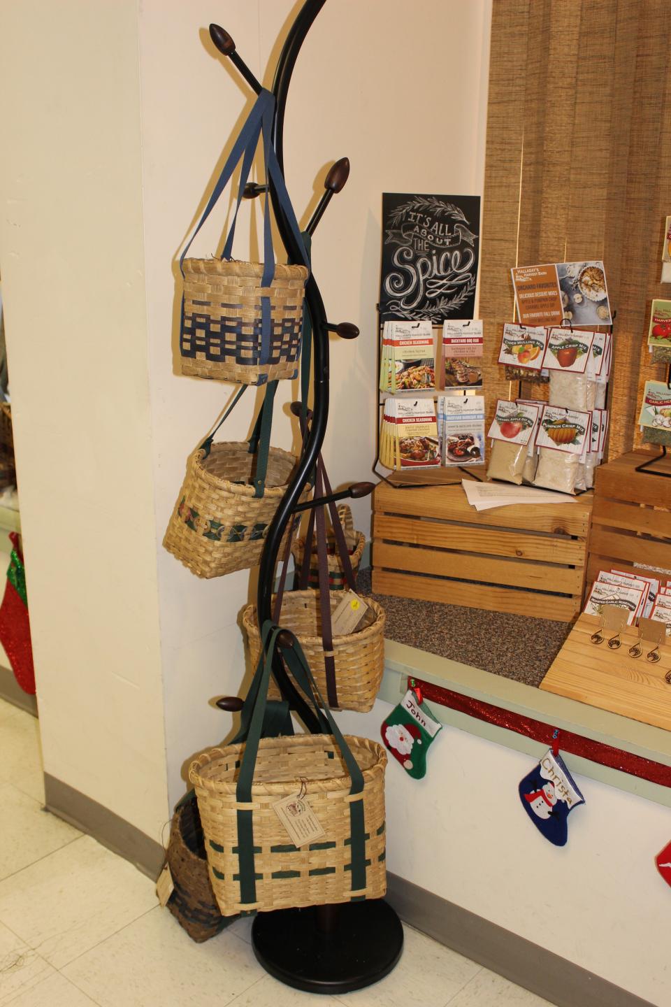 A display of handcrafted baskets hanging on a display rack