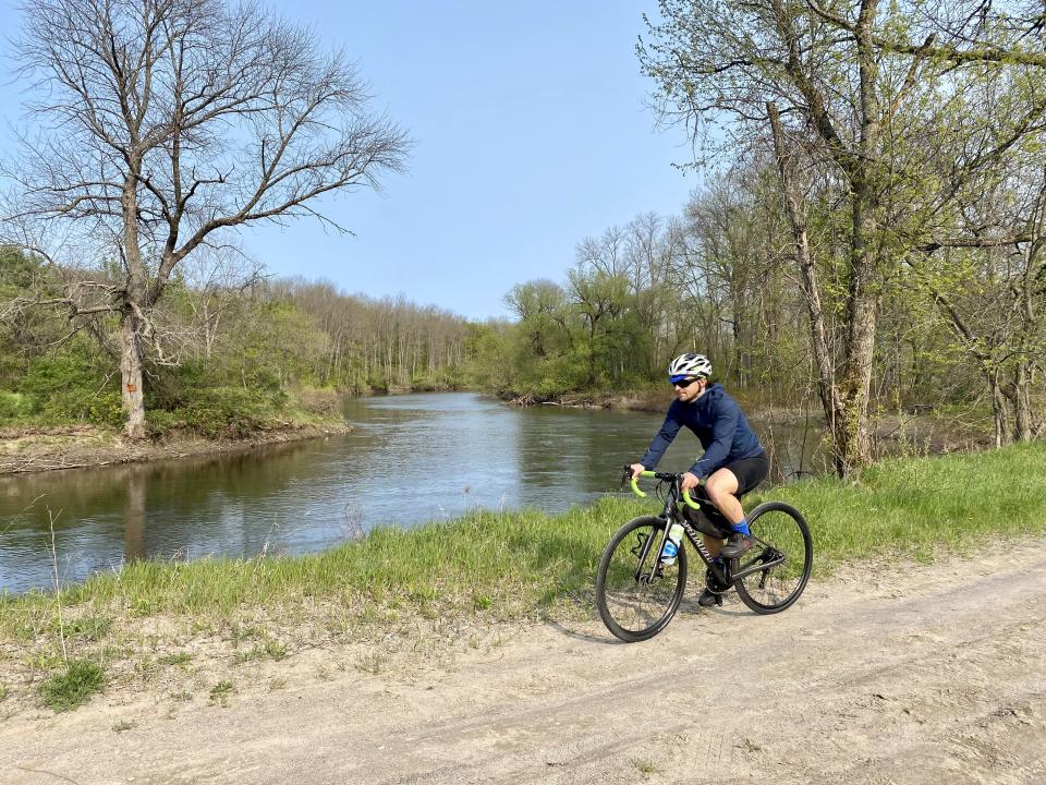 Cyclist enjoying view of river