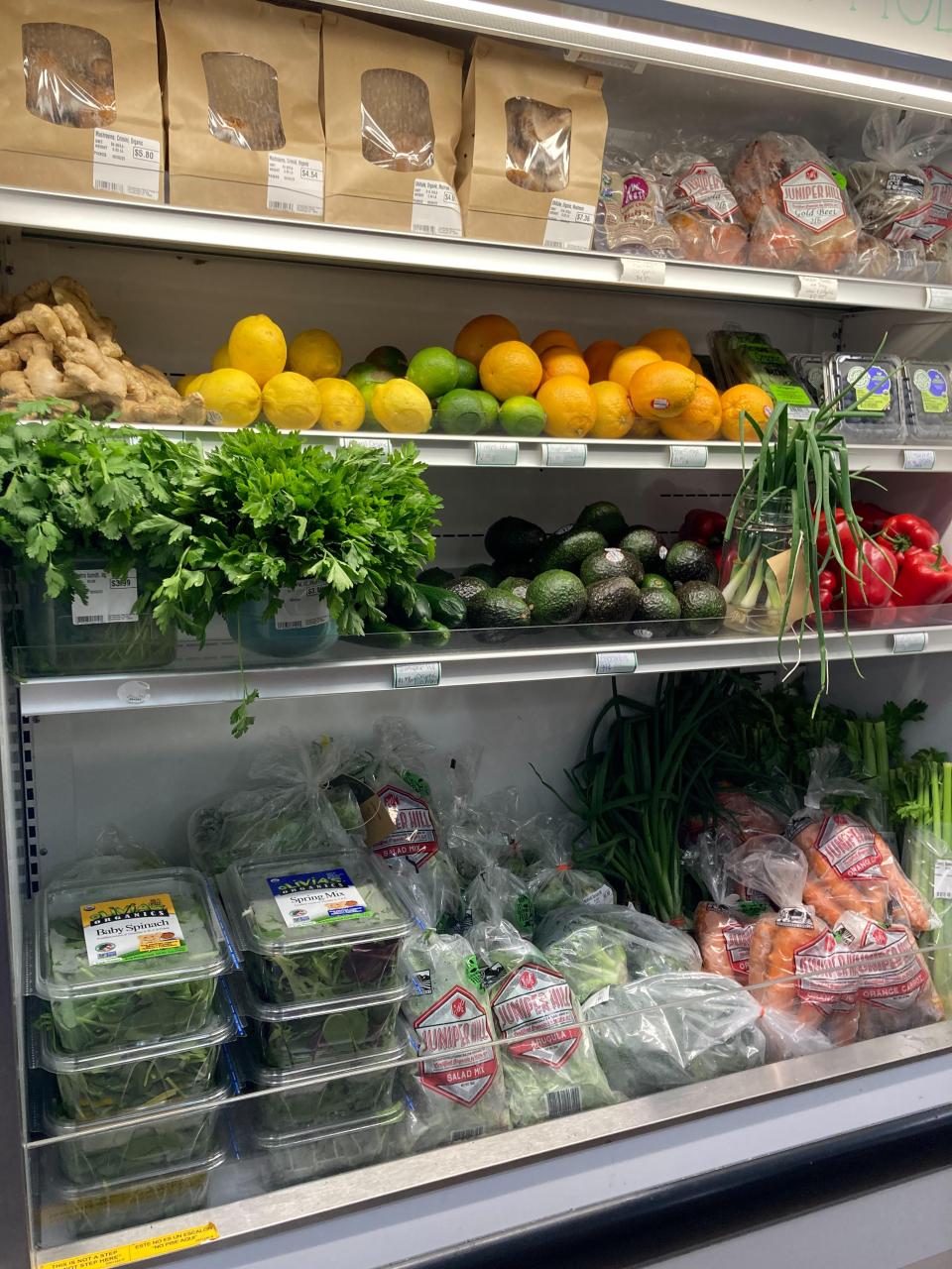 A few shelves of fresh produce and baked bread.