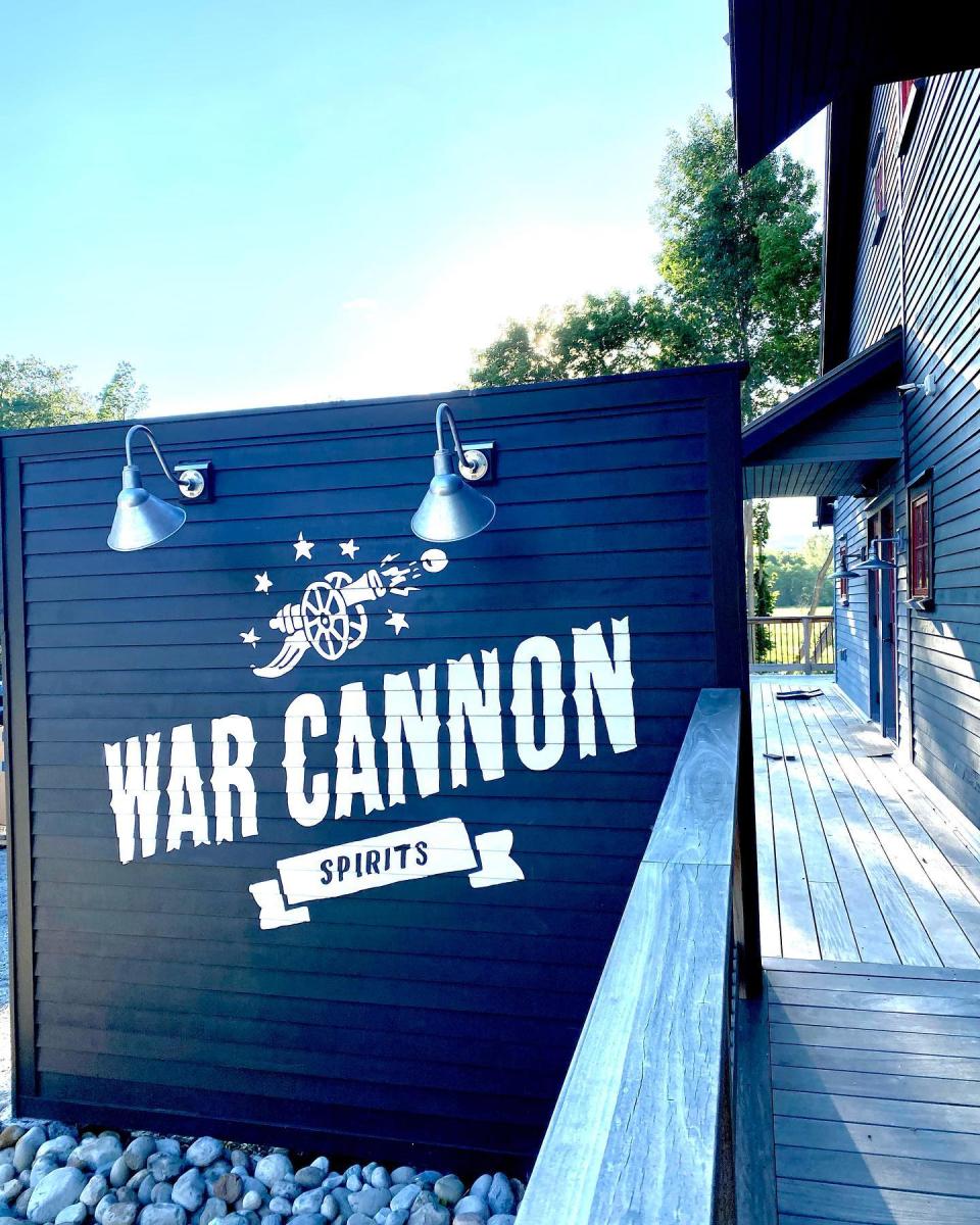 A view of the front entrance of War Cannon Spirits and the business logo sign