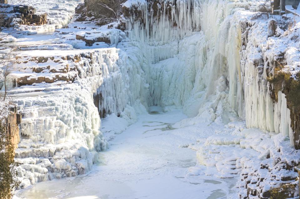 A close-up view of iced waterfalls and river.