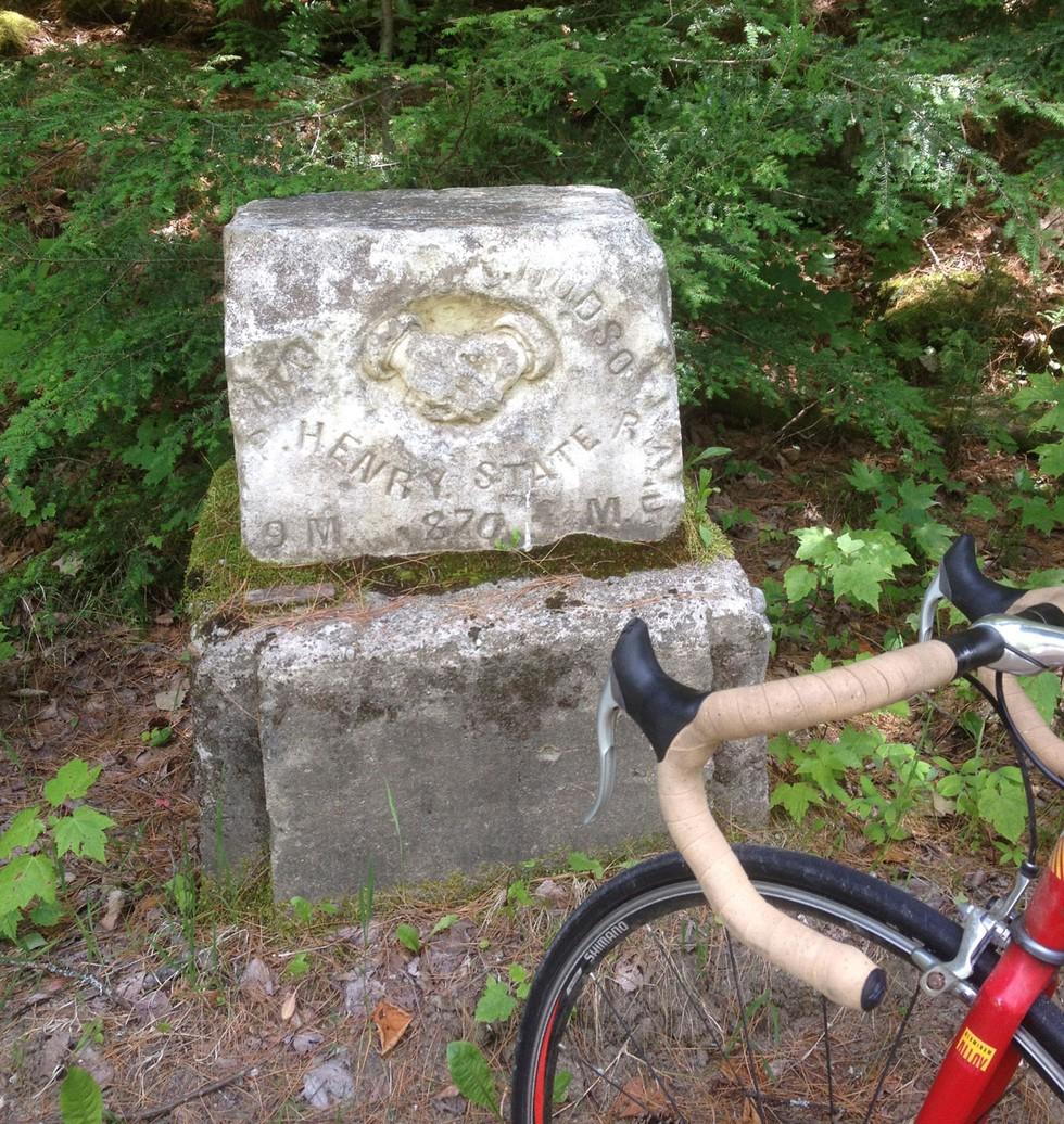 The stone with an image of the two shaking hands.
