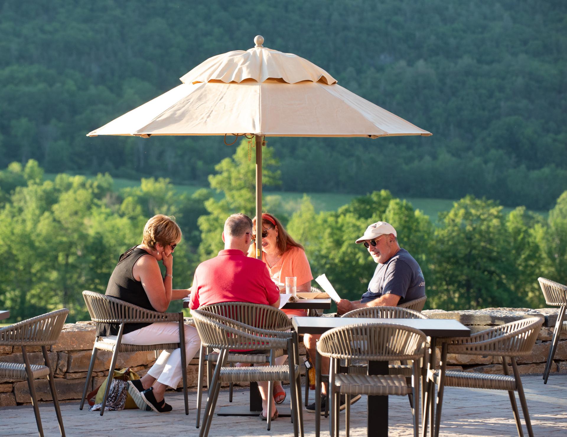 table of 4 diners on the terrace at ticonderoga golf course 