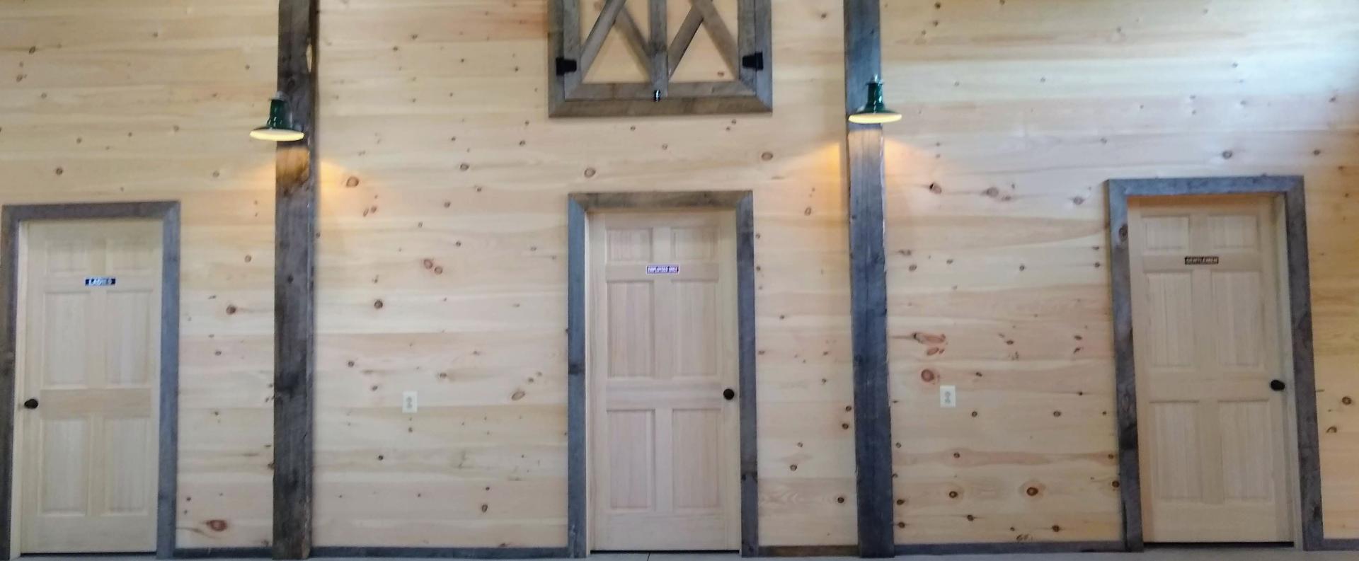 dark trim around the door of the storage room in the barn.