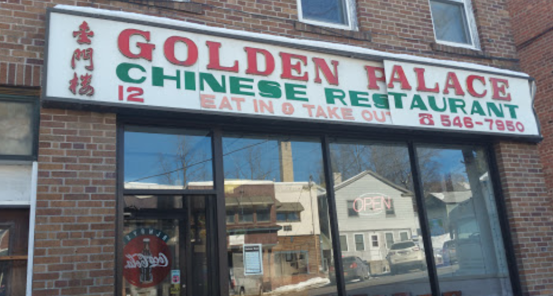 A large white sign above the window reading Golden Palace Chinese Restaurant.
