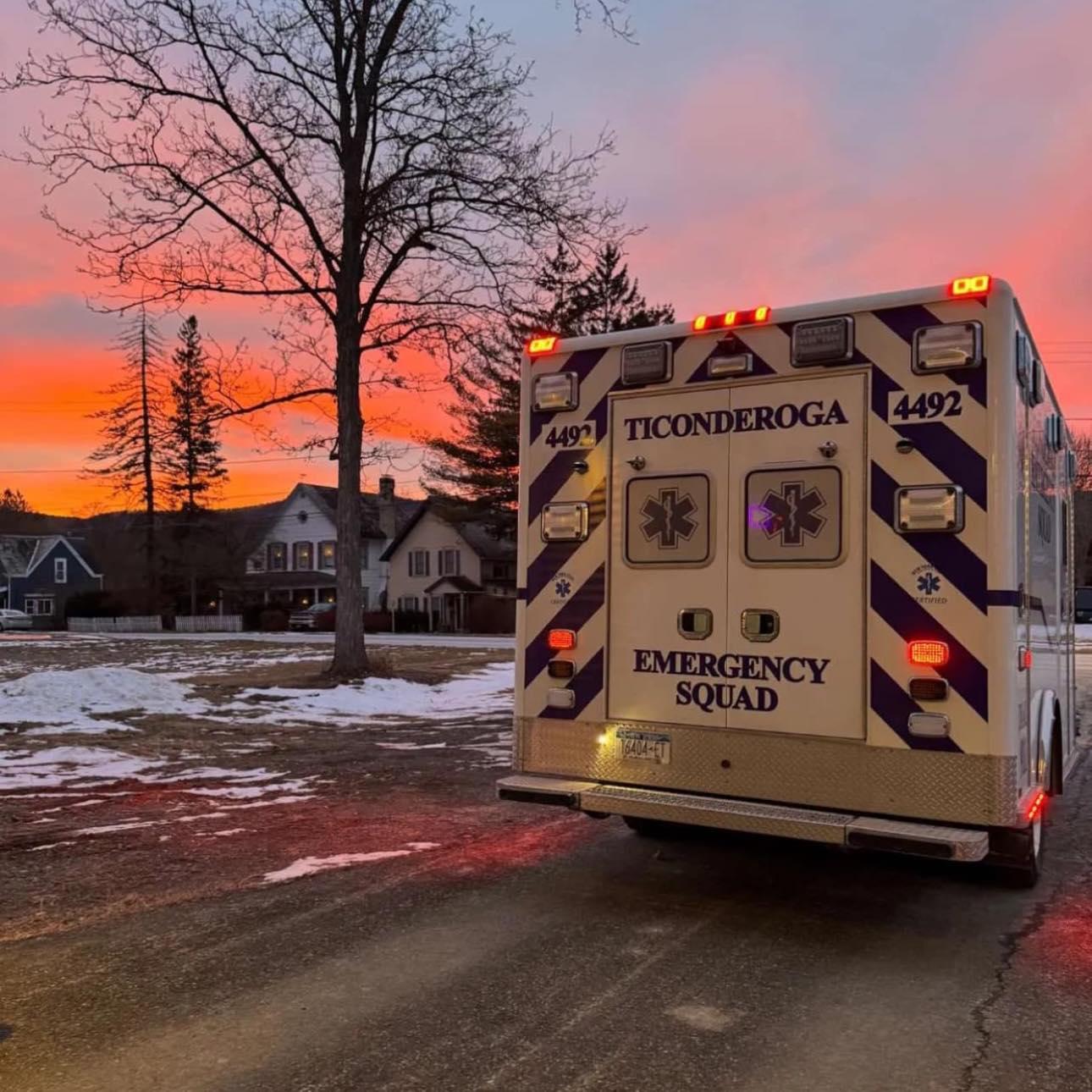 The Ticonderoga Emergency Squad ambulance sits under a sky the colors of cotton candy at sunset.