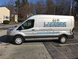 A white sprinter van with Lakeside Plumbing and Heating on the side.