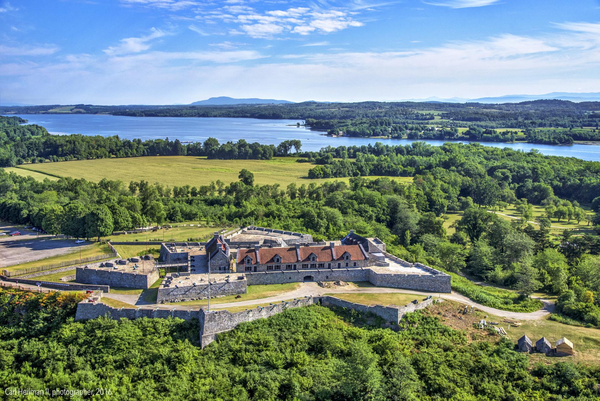 An aerial view of the fort with Lake Champlain in the distance