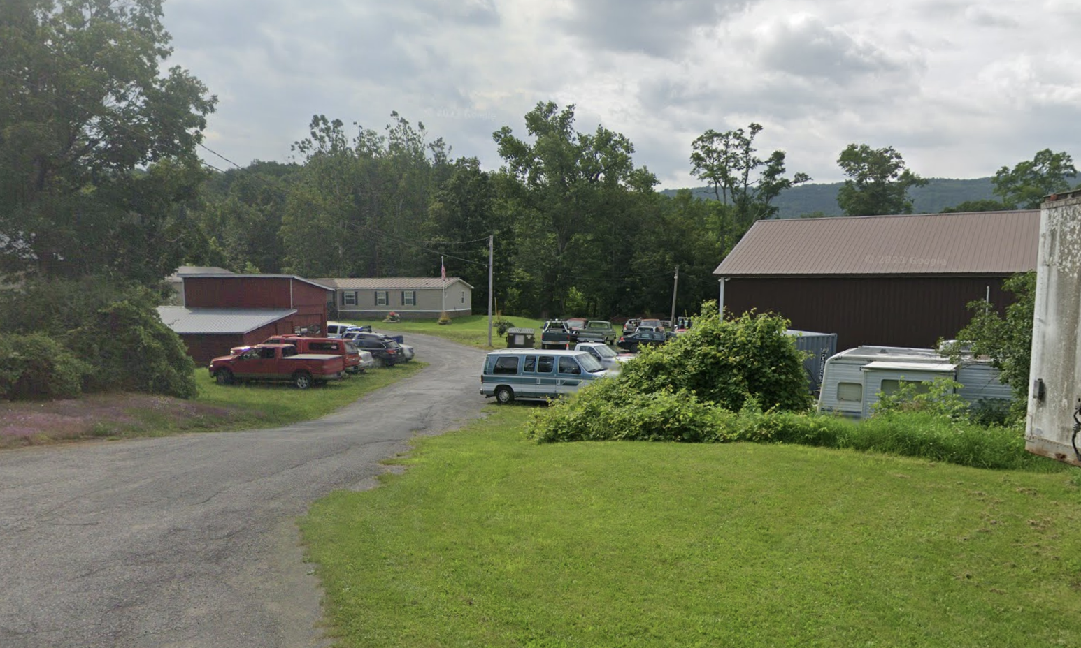 Cars out front of Tromblee Towing and Auto Repair.