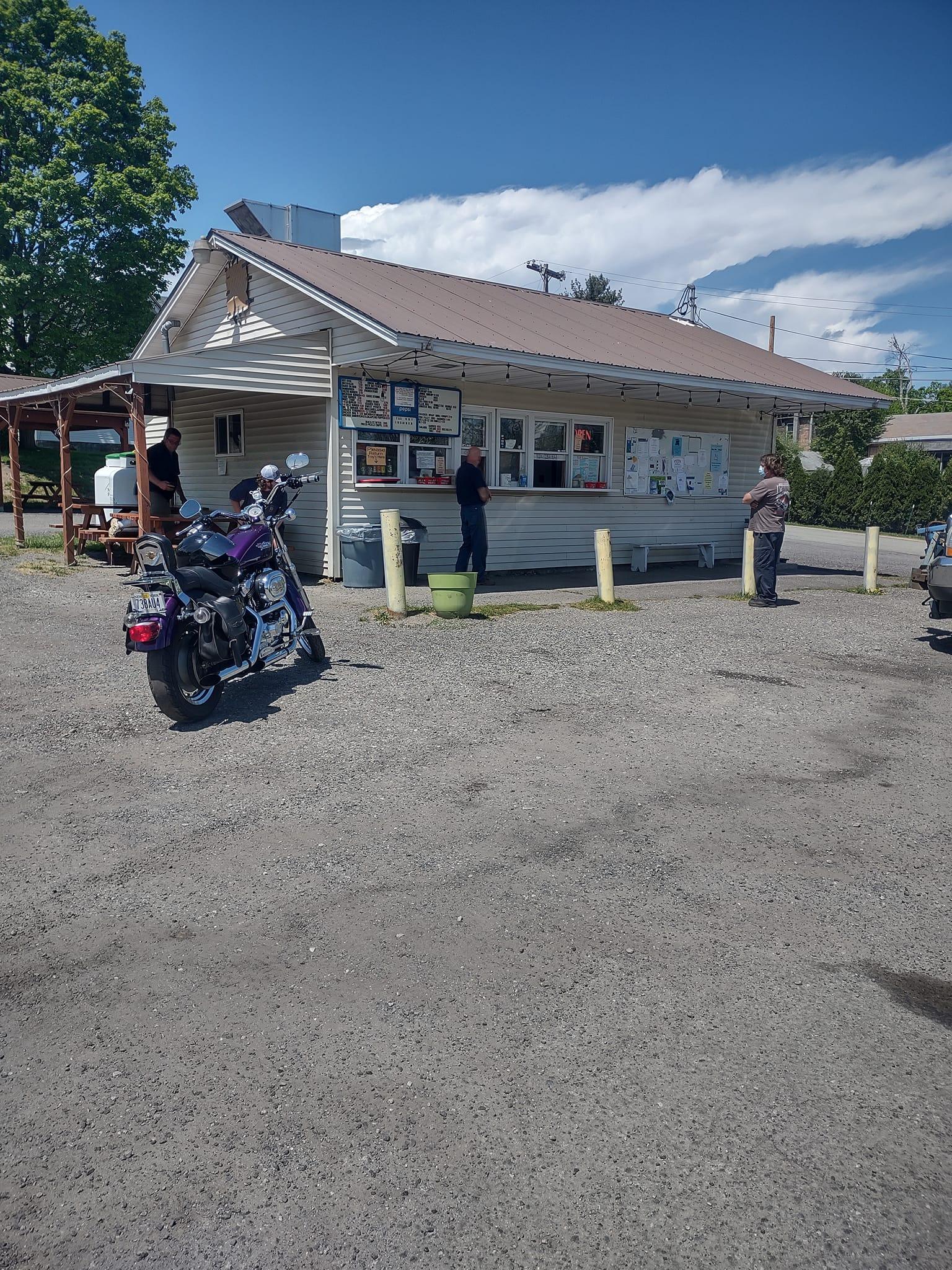a snack bar in a parking lot on a sunny day.