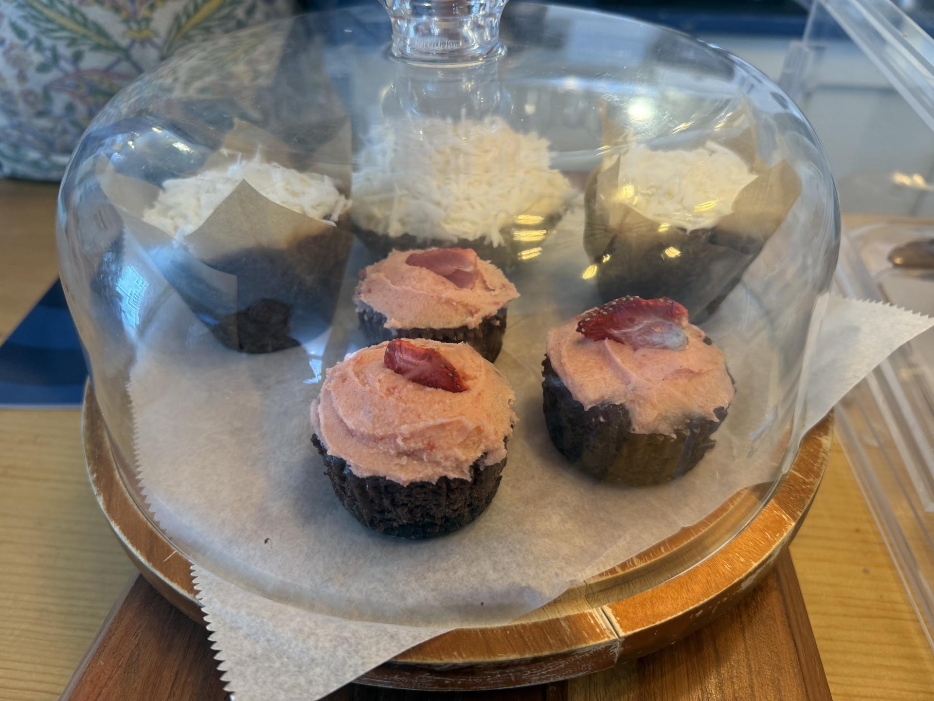 Exterior of the Essex Ice Cream Cafe with dining tables and yellow umbrellas