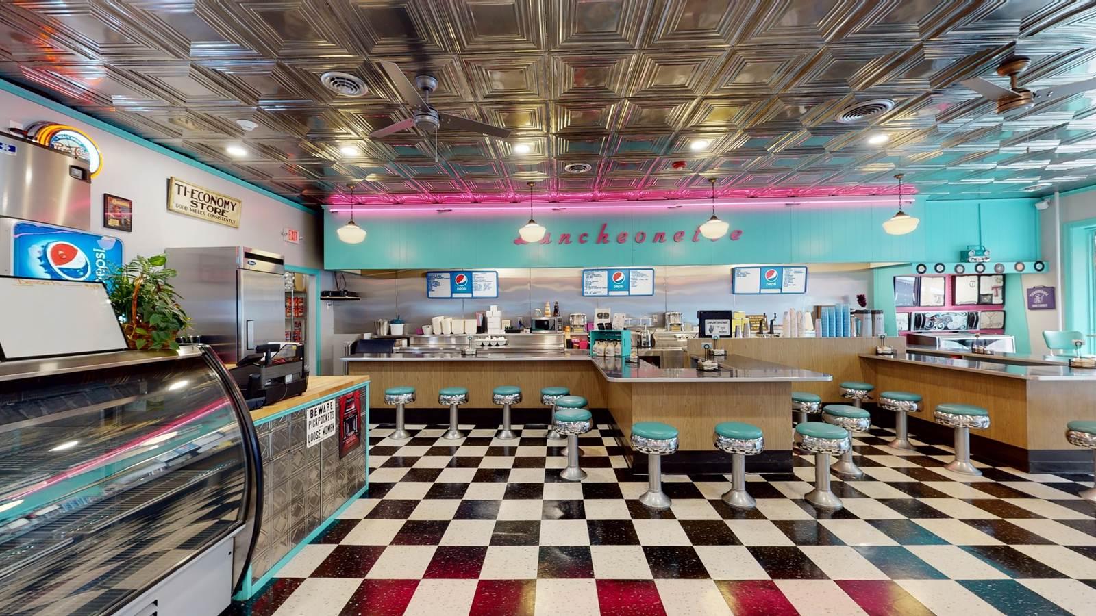 The dining bar with teal stools.