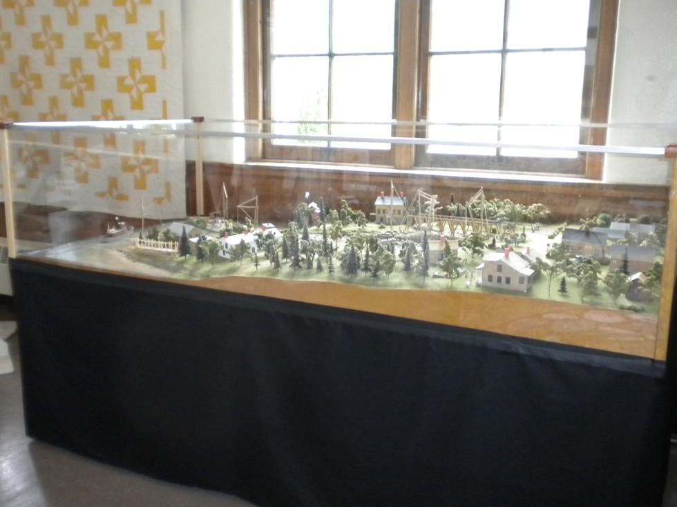 A model of a historical representation of Willsboro under glass.