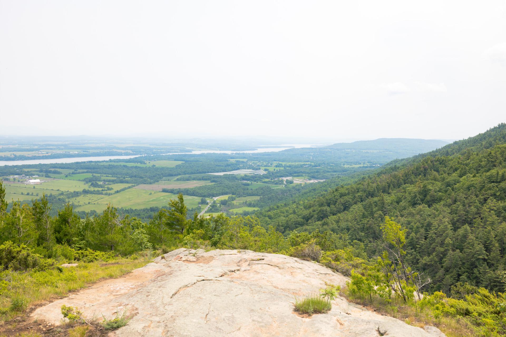 View from a rocky summit over farmland