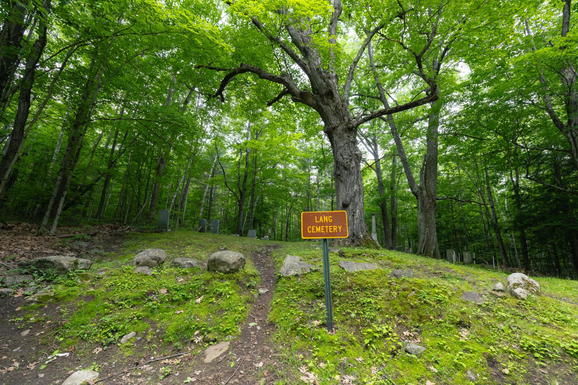 A sign for Lang Cemetary along the trail.