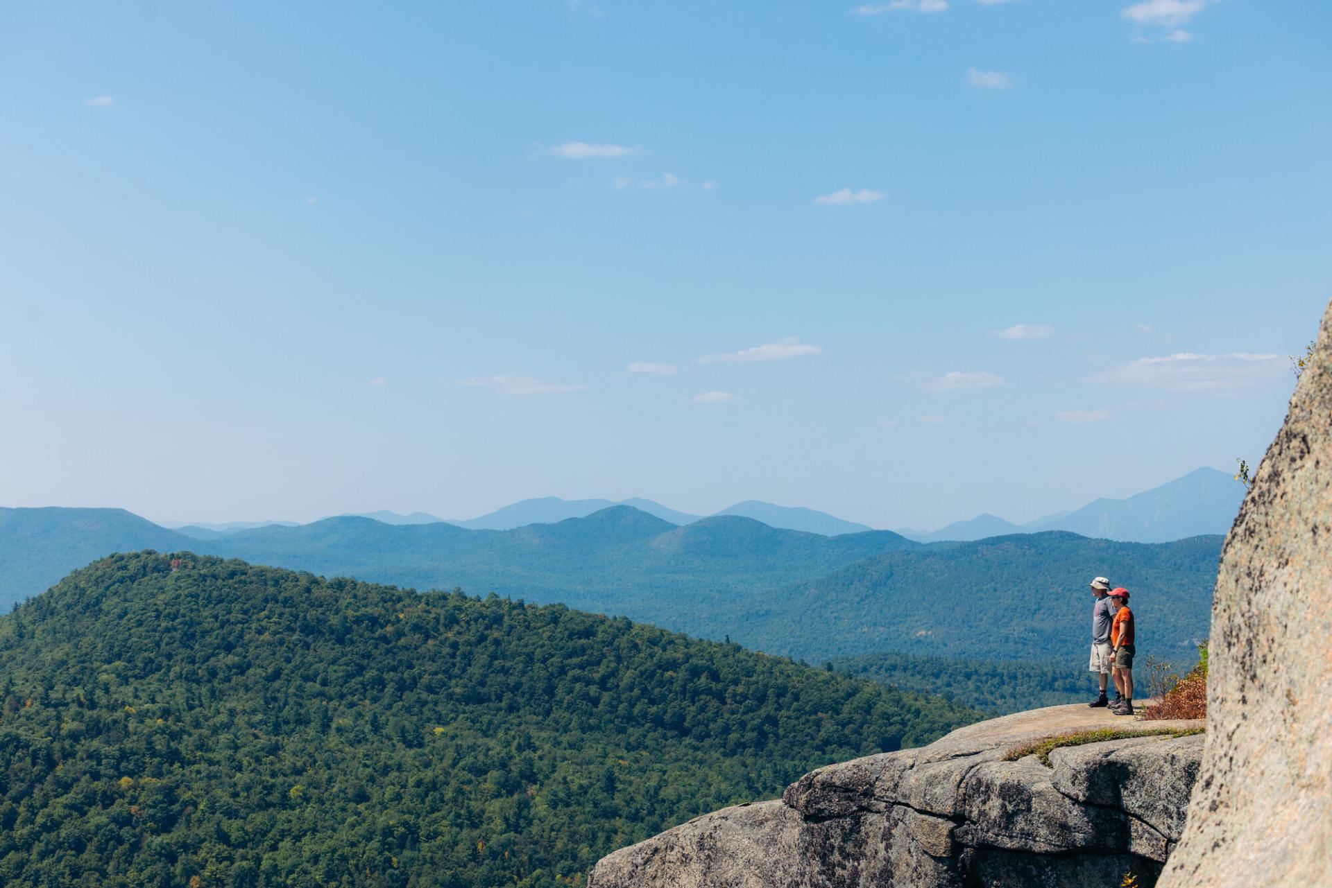 Two hikers on a broad overlook
