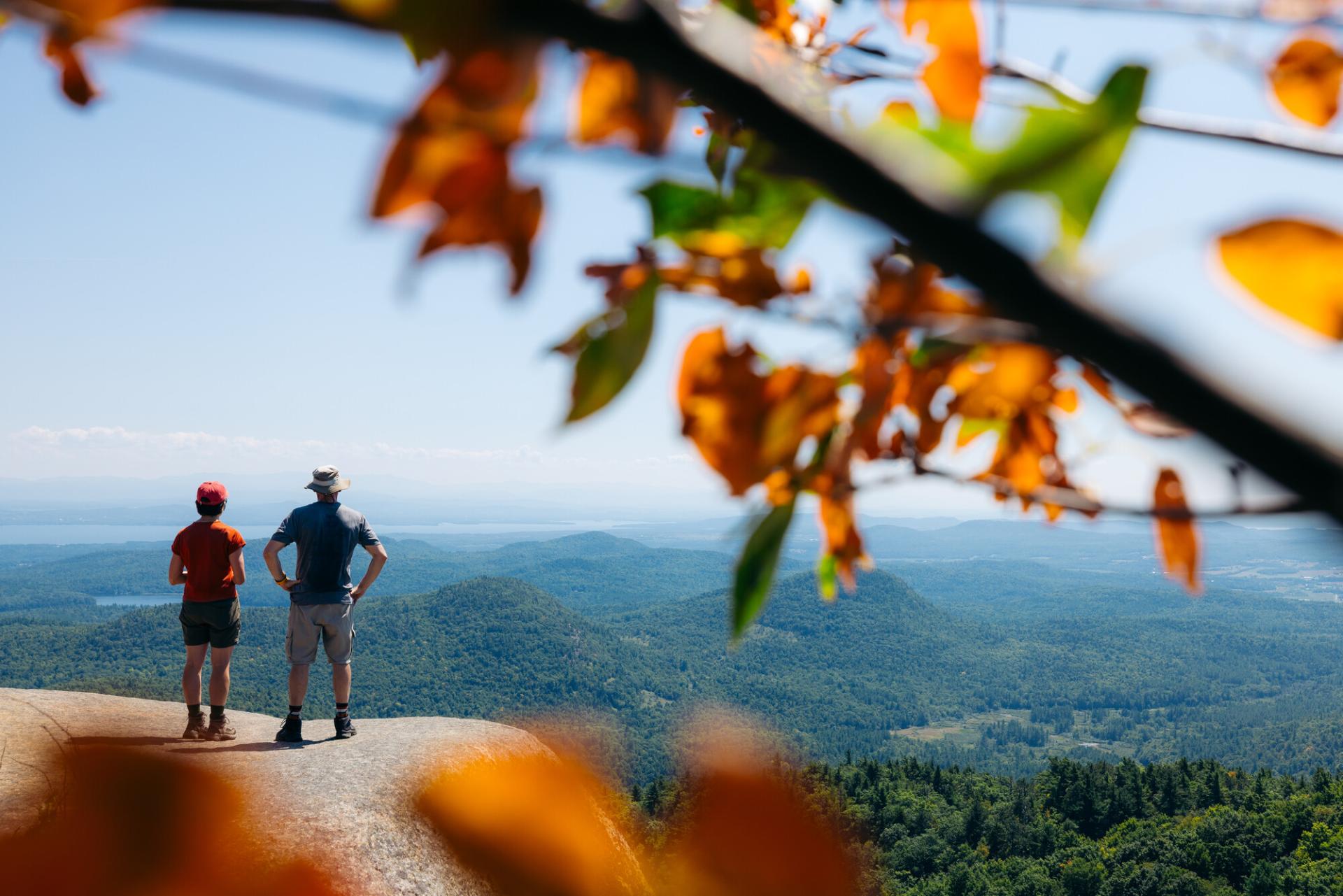 Two hikers looking at the view from an overlook