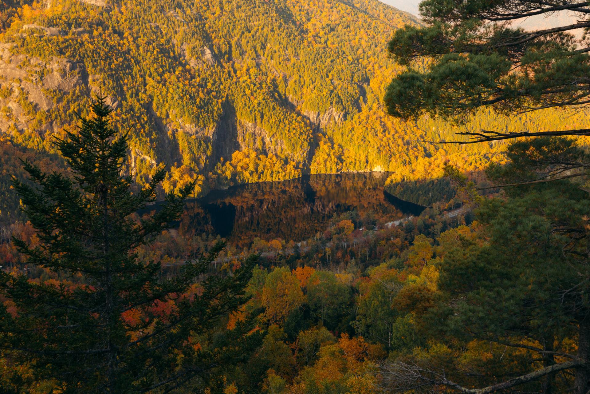Looking down at a road and cliffs in the fall