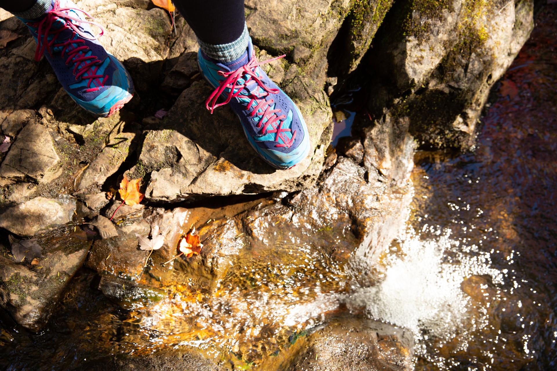 Hiking book near a stream