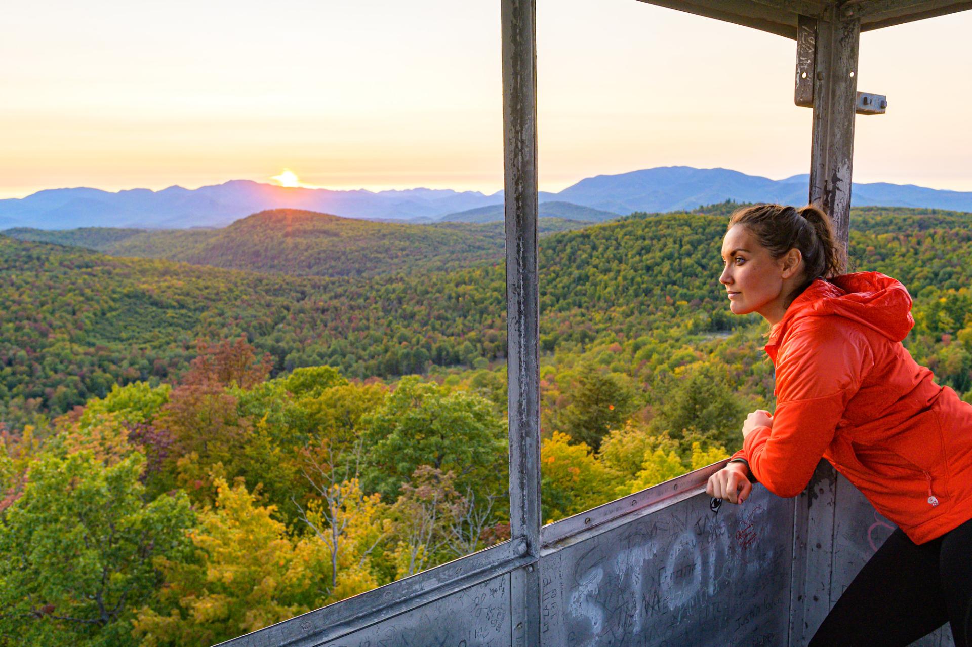 A woman looking out from a firetower