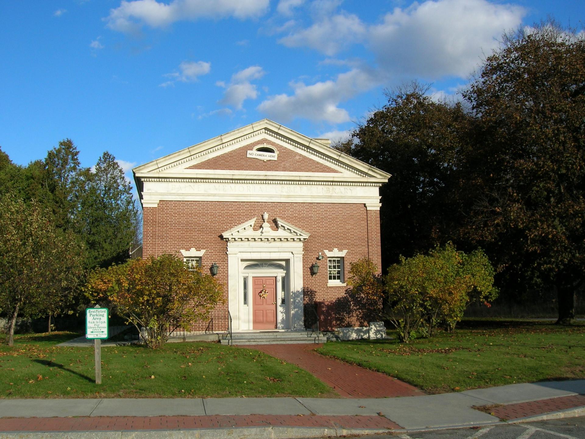 The decoration above the front door is known as a scroll pediment.