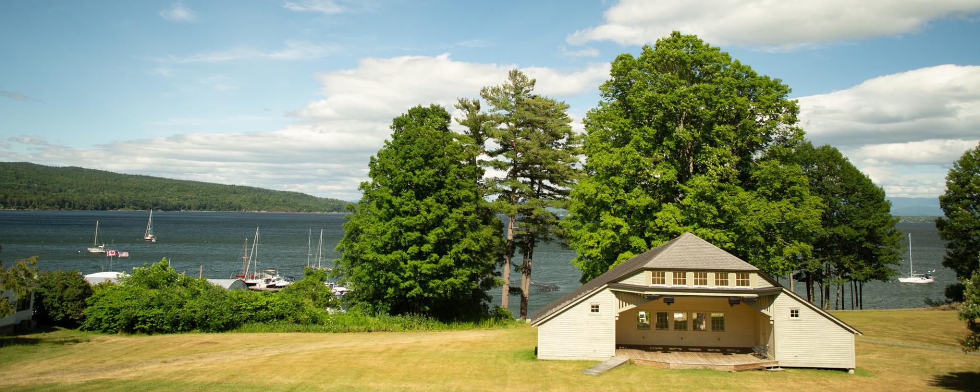 View of a park and pavilion by the lake