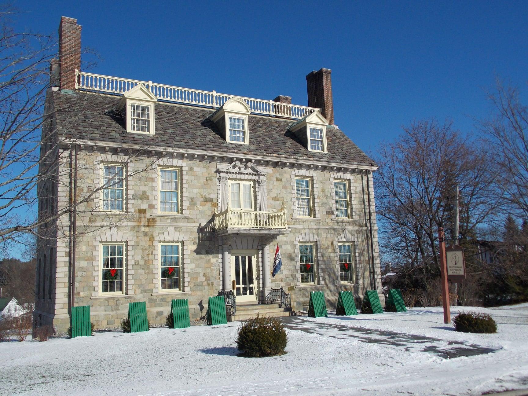 historical stone home in winter